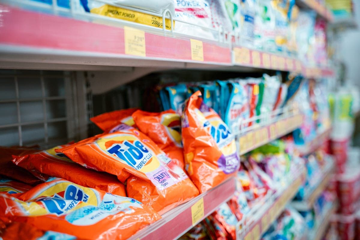 Household products lined up on a supermarket shelf