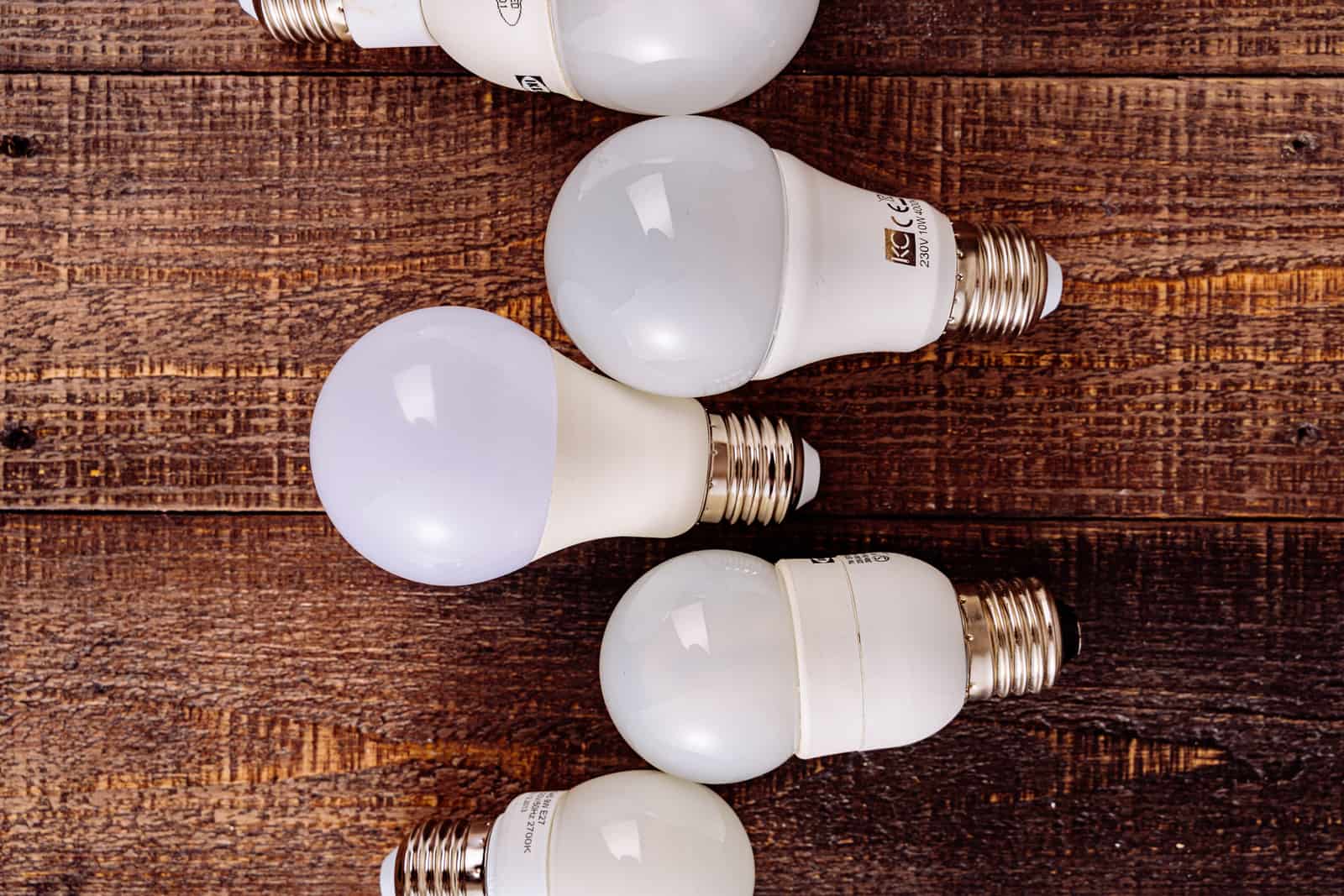 Light bulbs arranged on a wooden workbench