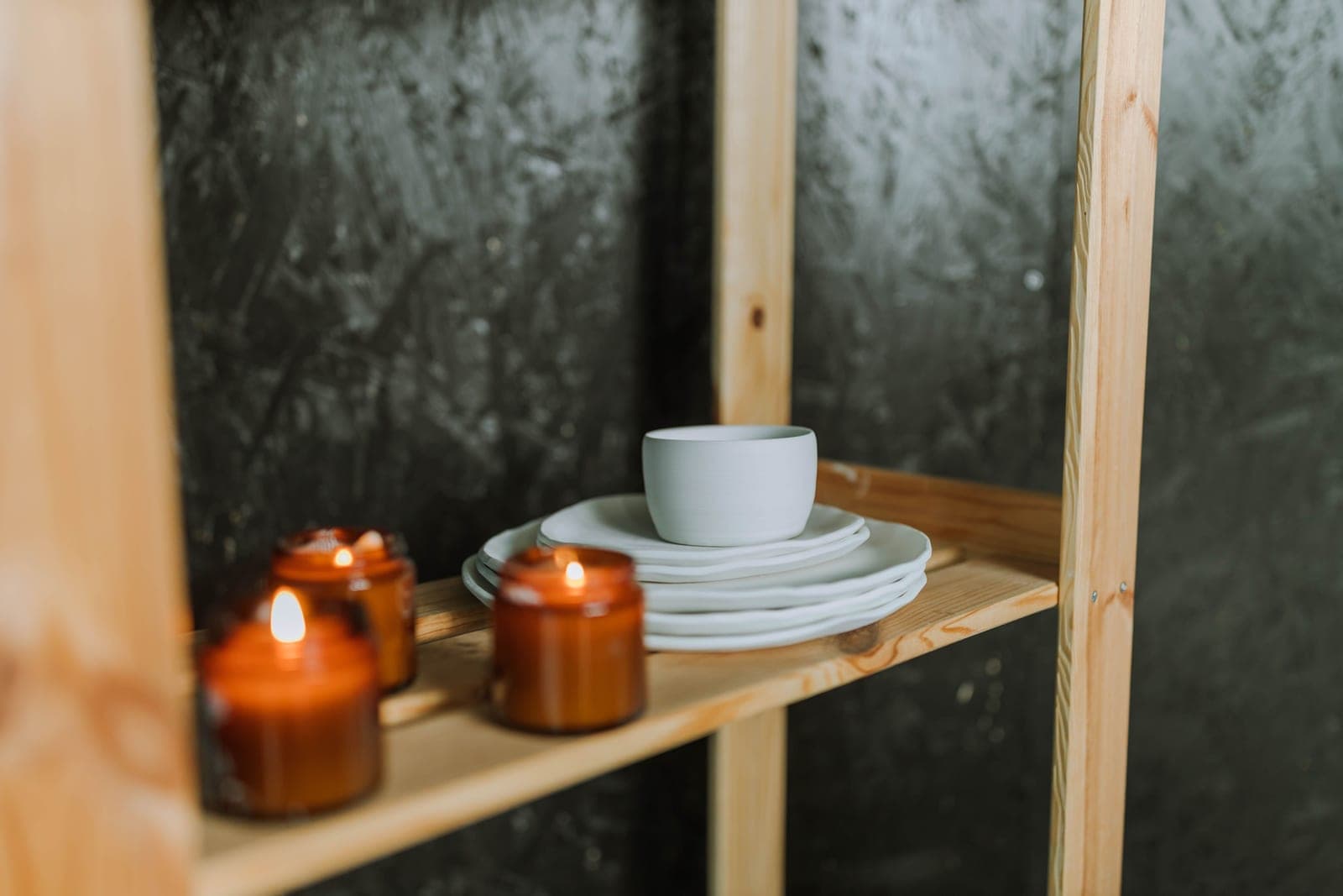 A white ceramic dish on a wooden table in soft light