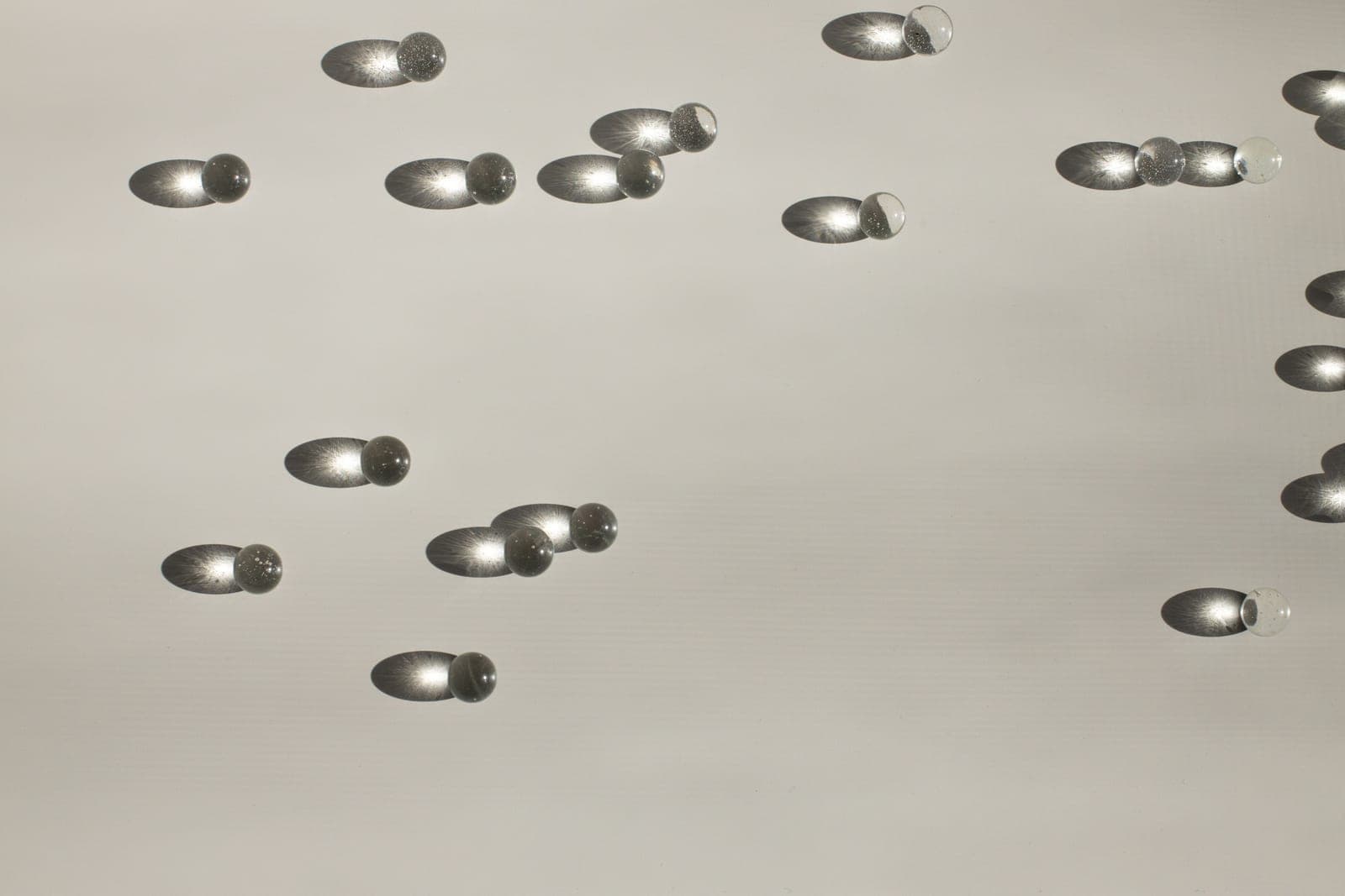 Small wax melt shapes arranged on a pale surface