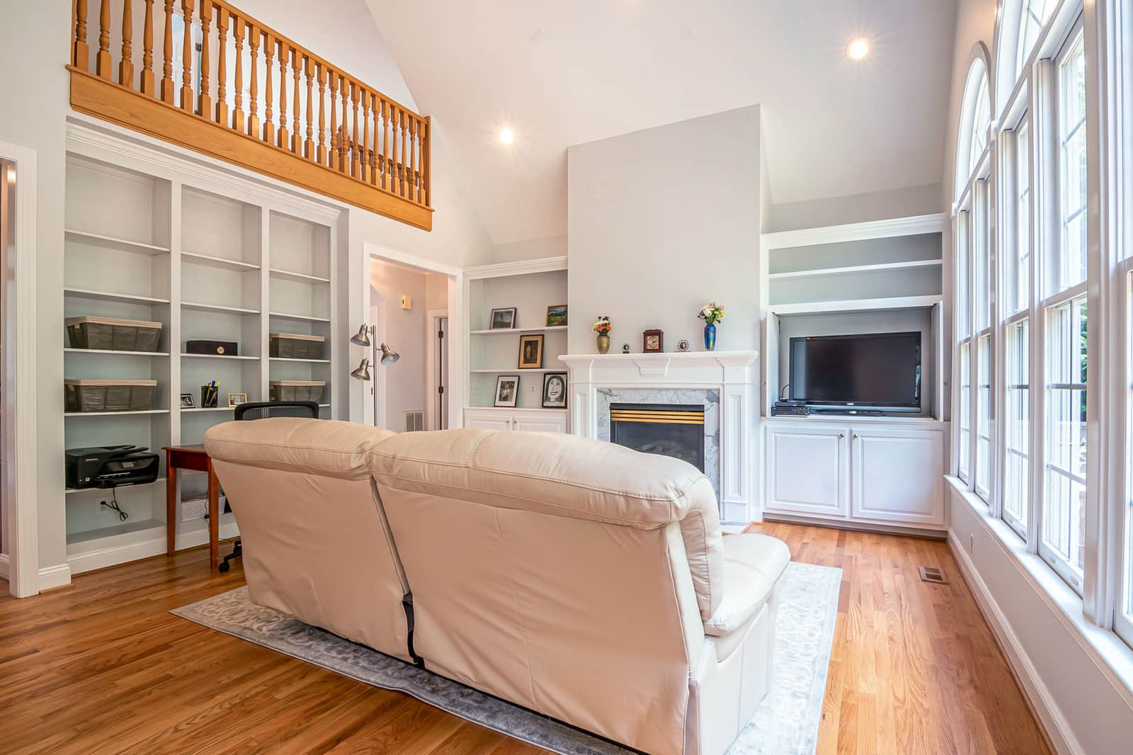 A large open-plan living room with a high ceiling